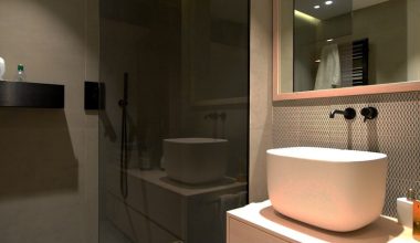 white ceramic sink near mirror