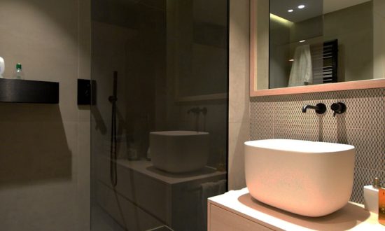 white ceramic sink near mirror